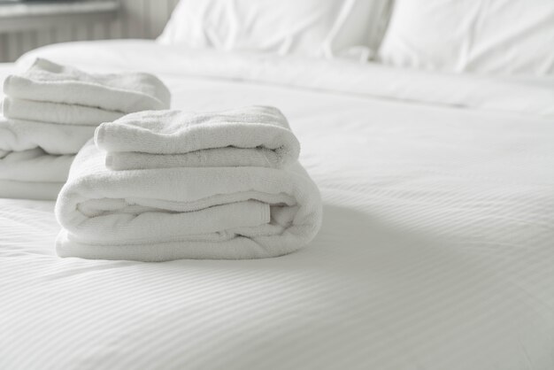 White towel on bed decoration in bedroom interior