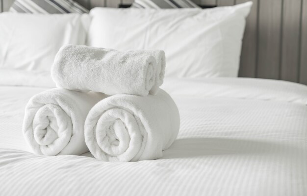 White towel on bed decoration in bedroom interior