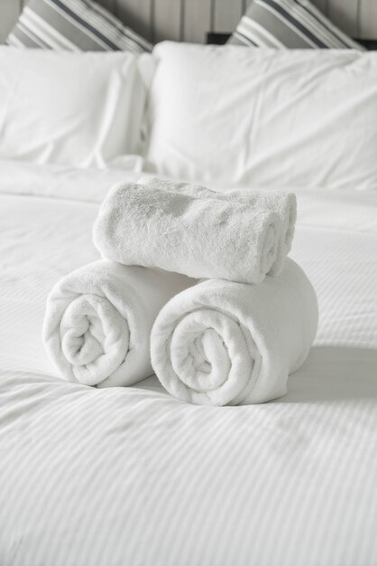 White towel on bed decoration in bedroom interior