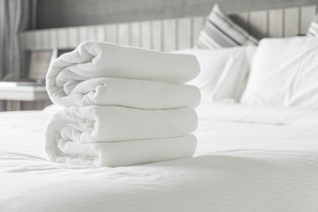 White towel on bed decoration in bedroom interior