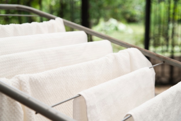 White towels drying on clotheshorse