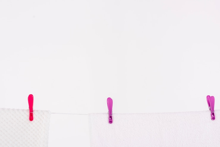 Free Photo white towels drying on clothesline with copy-space
