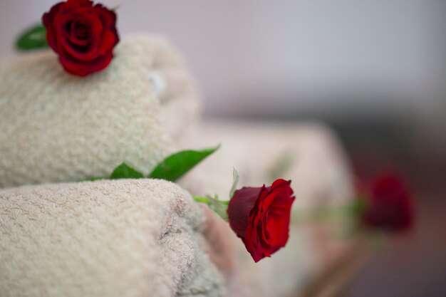 White towels with red roses