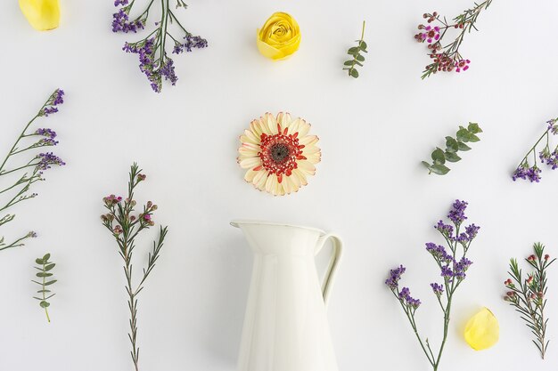 White vase with decorative flowers