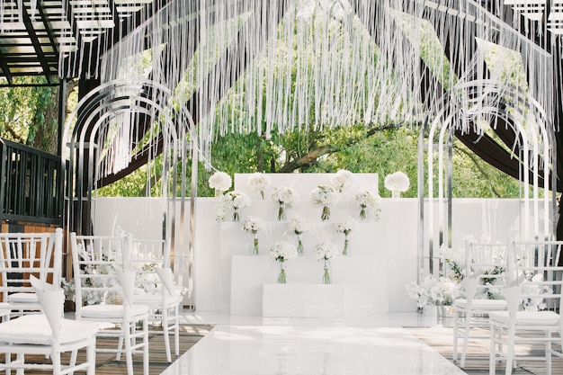 White wedding decorated with flowers