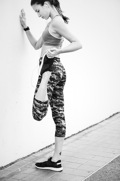 White woman stretching before exercise