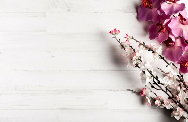 White wooden background with beautiful flowers
