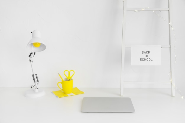 White workplace with yellow mug