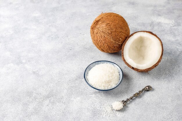 Whole coconut and various pieces of coconut