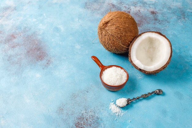 Whole coconut and various pieces of coconut