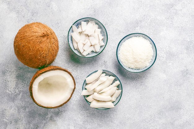 Whole coconut and various pieces of coconut