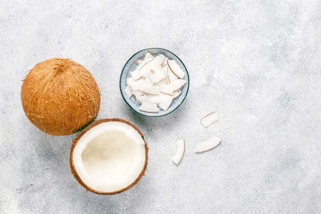 Whole coconut and various pieces of coconut