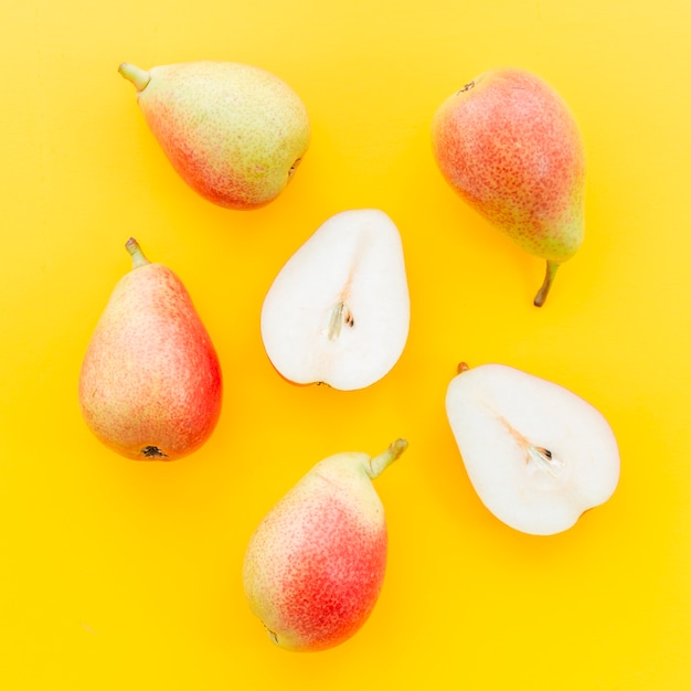 Whole and cut pear with seeds