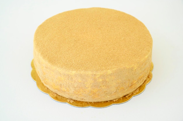 Whole eightlayered honey cake Russian cake Medovik with walnuts and biscuit covered in honey