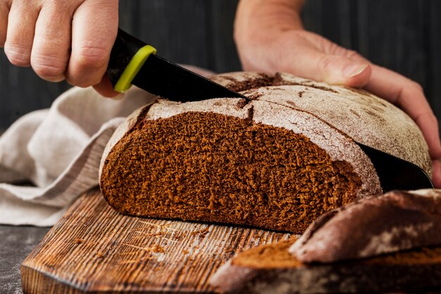 Whole-grain bread on cutting board front view