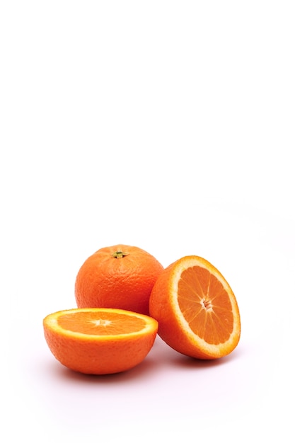 Whole orange fruit and one cat in half on a white isolated