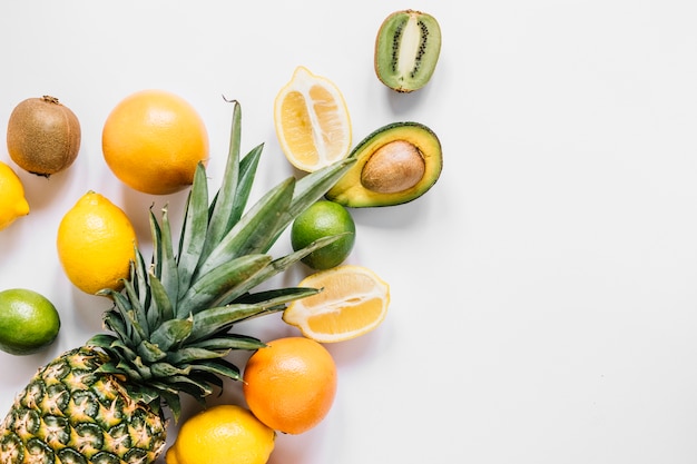 Whole pineapple near fruits