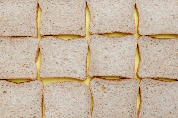 Wholegrain toast bread slices on yellow