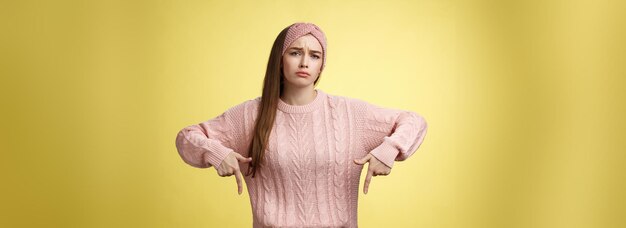 Free photo why me gosh gloomy upset complaining cute glamout young european girl in casual sweater headband