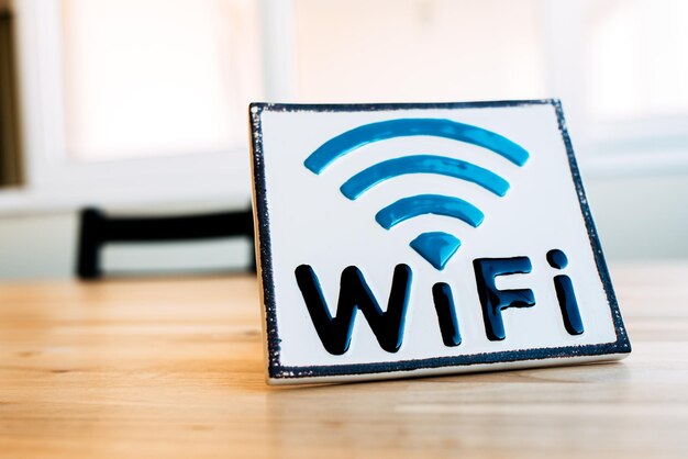 Wi Fi sign on wooden wall in corridor of modern building