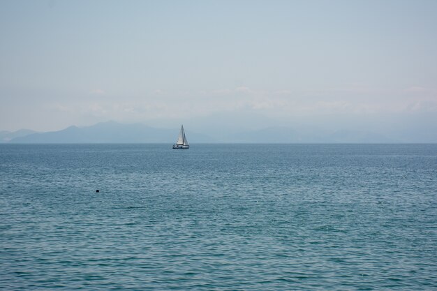 Wide angle shot of a ship that is sailing over the ocean