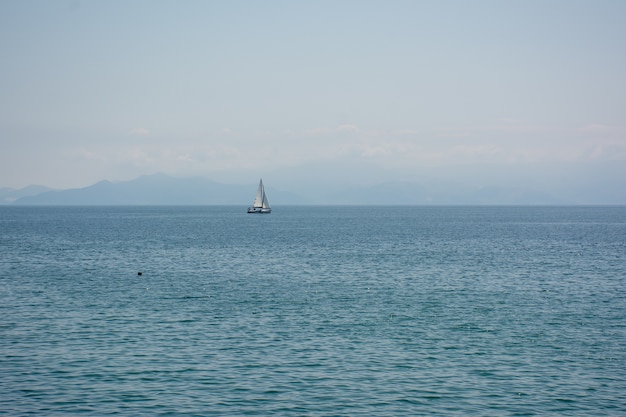 Wide angle shot of a ship that is sailing over the ocean