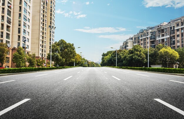 Wide road with buildings on either side