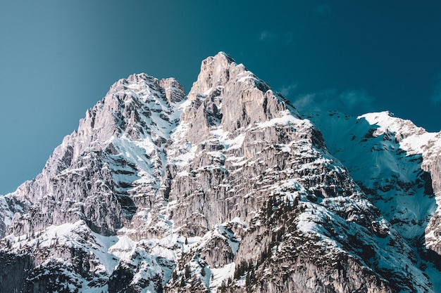 Wide shot of a part of a mountain range below it in winter