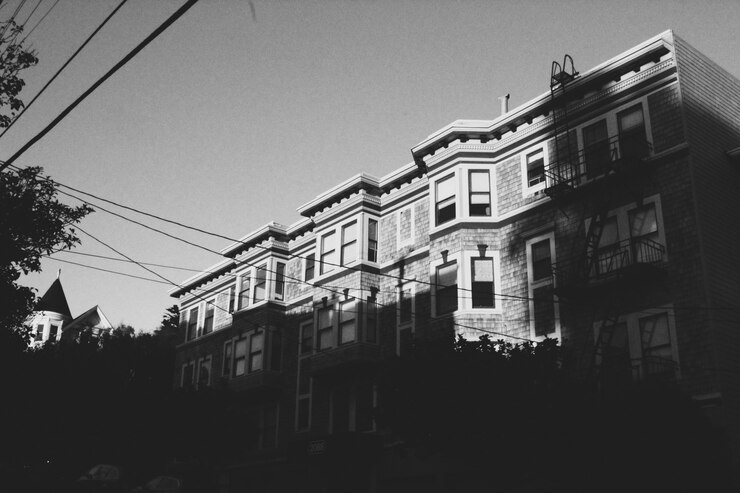 Free Photo wide vertical shot of the beautiful architecture of an urban city on a sunny day
