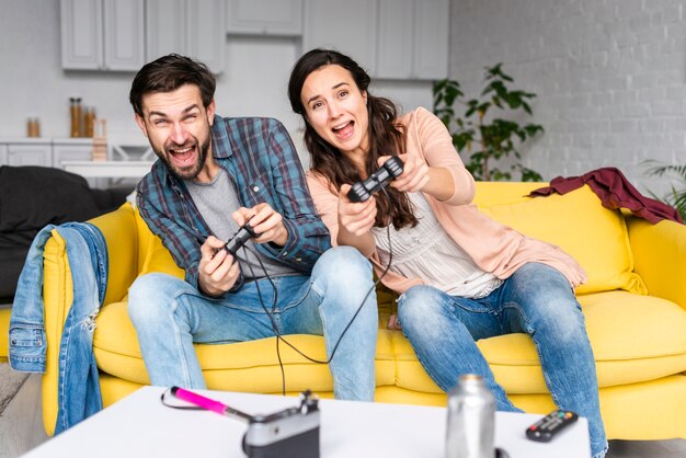 Wife and husband playing video games