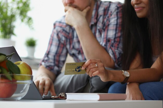 Wife and husband want to buy something online via credit card payment