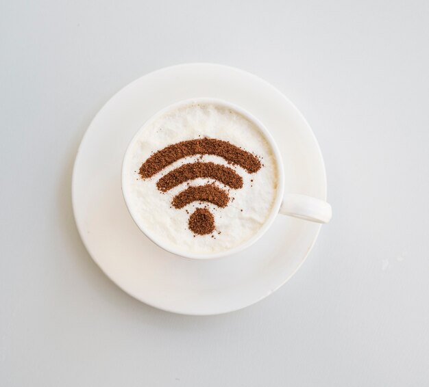 Wifi symbol drawn on cup on plain background