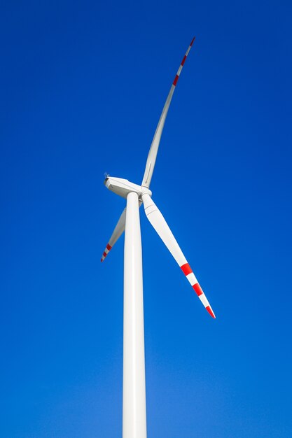 Wind turbine on blue sky without clouds