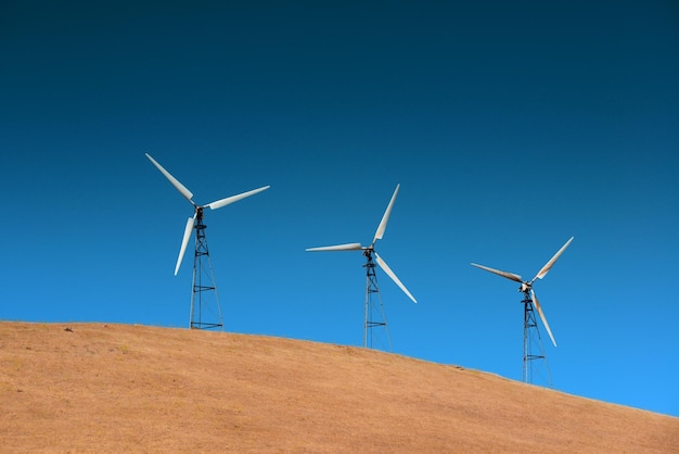 Wind turbine over mountain near San Francisco.