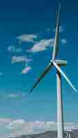 Free photo wind turbine with a blue sky