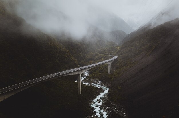 winding highway bridge in foggy valley