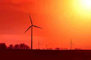 Free photo windmill at sunset