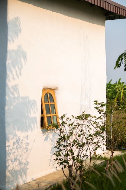 Free photo window and house in sunset