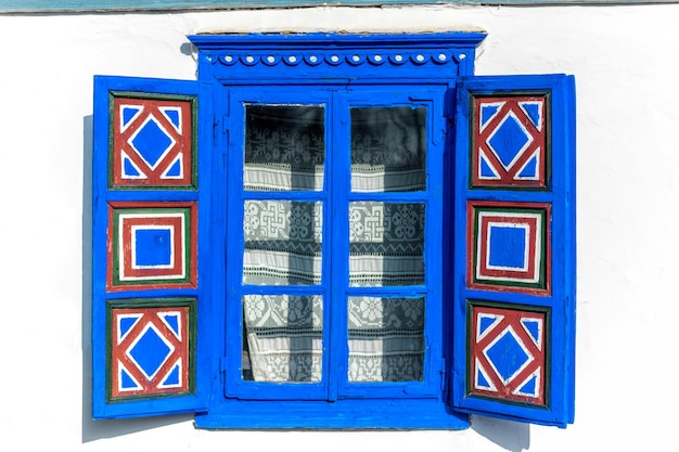 Free photo window of an old residential building in village museum in bucharest romania