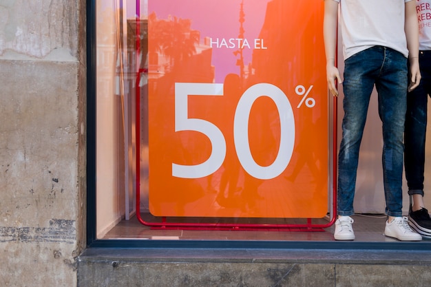 Window shop with sales poster