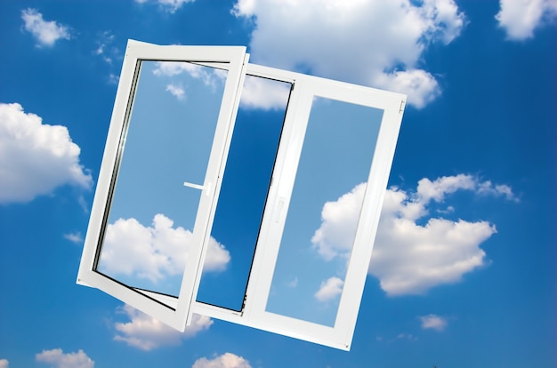 Free photo window with clouds background