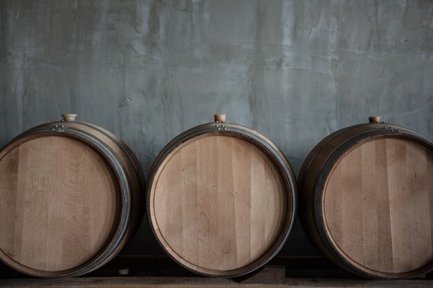 Wine barrels stacked in the cellar of the winery