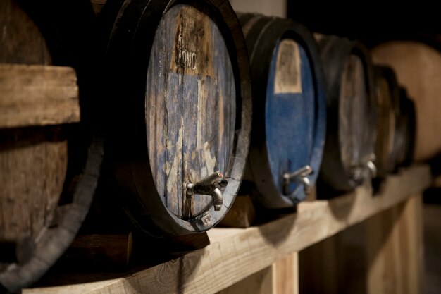 Wine cellar with old wine barrels arrangement