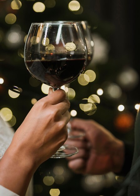 Wine glasses in front of little lights