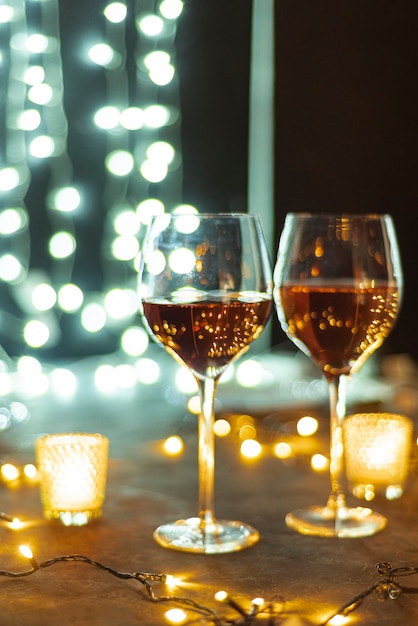 Wine glasses on a table bokeh background bac
