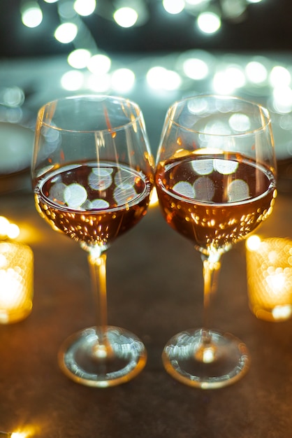 Wine glasses on a table with bokeh background