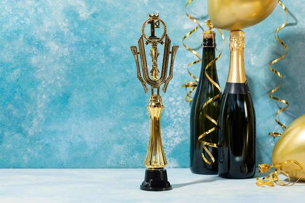 Winner concept with golden prize and champagne