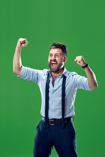 Dynamic Energetic Image of a Winning Success Man Celebrating Victory