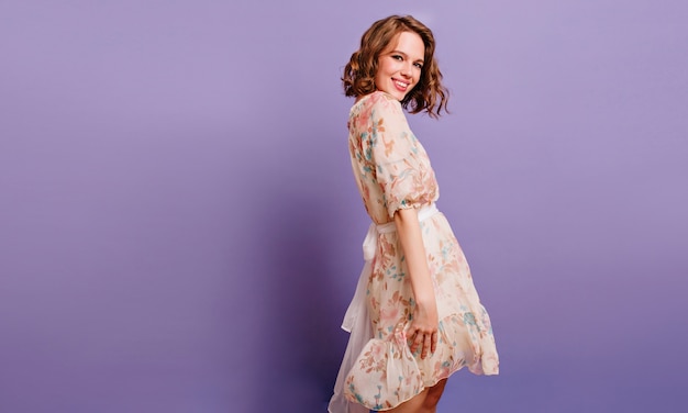 Free photo winsome girl in romantic attire pretty smiling on purple background