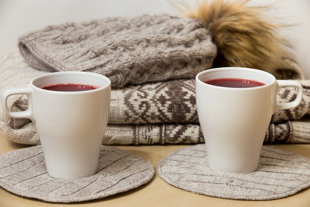 Winter clothes and two cups of mulled wine